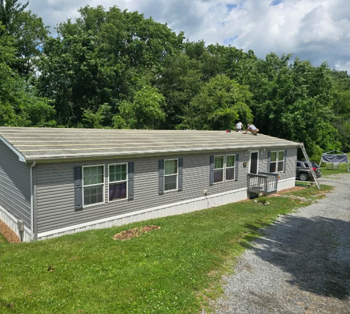 Crew installing a manufactured home roof